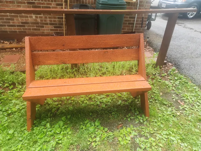 Red stain shown on a completed outdoor bench