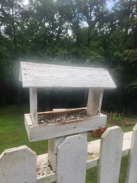 Weathered white finish shown on a completed bird feeder